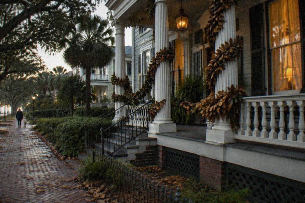 Decorated historic building facade with autumn garlands in a coastal town