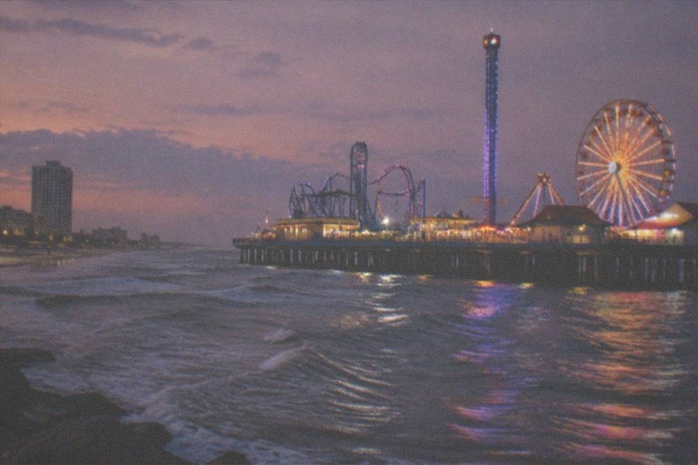 Amusement pier rides over the Gulf water along the Galveston seawall